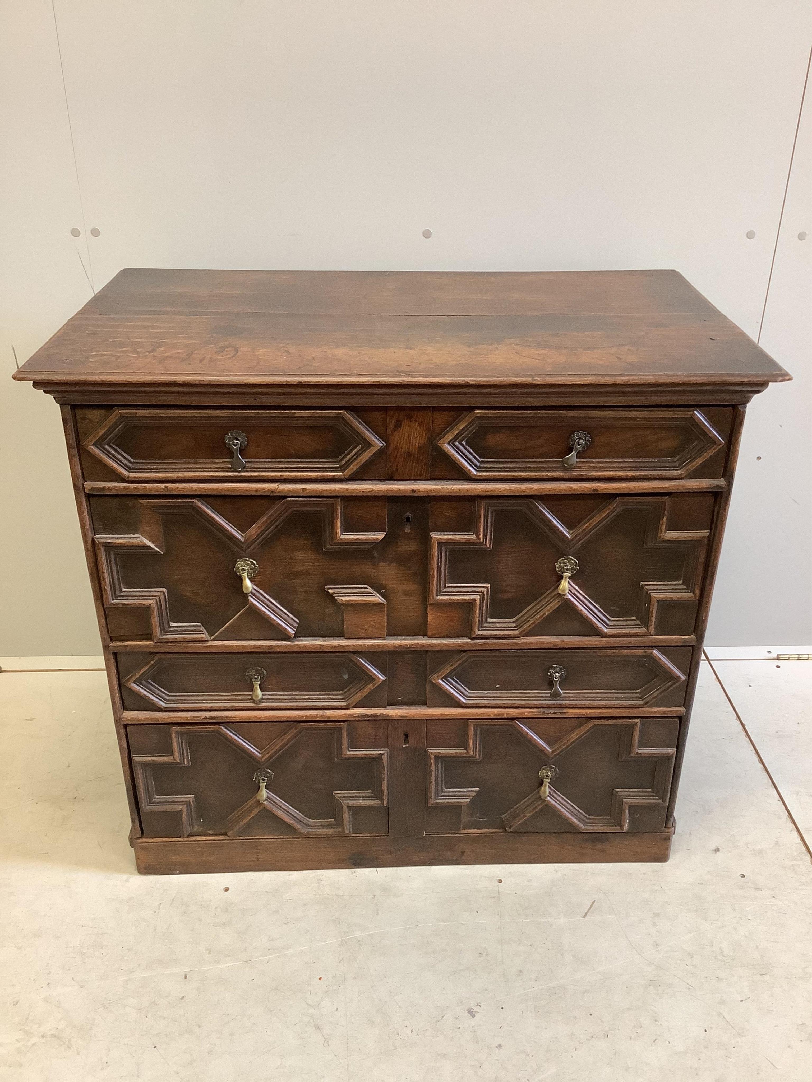 An 18th century geometric moulded oak chest, width 95cm, depth 54cm, height 86cm. Condition - fair